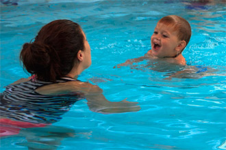 Boy at swimming lesson with mum - Shapland Swim Schools Moorooka