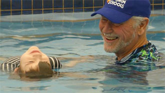 Chris Shapland and student during swimming lesson
